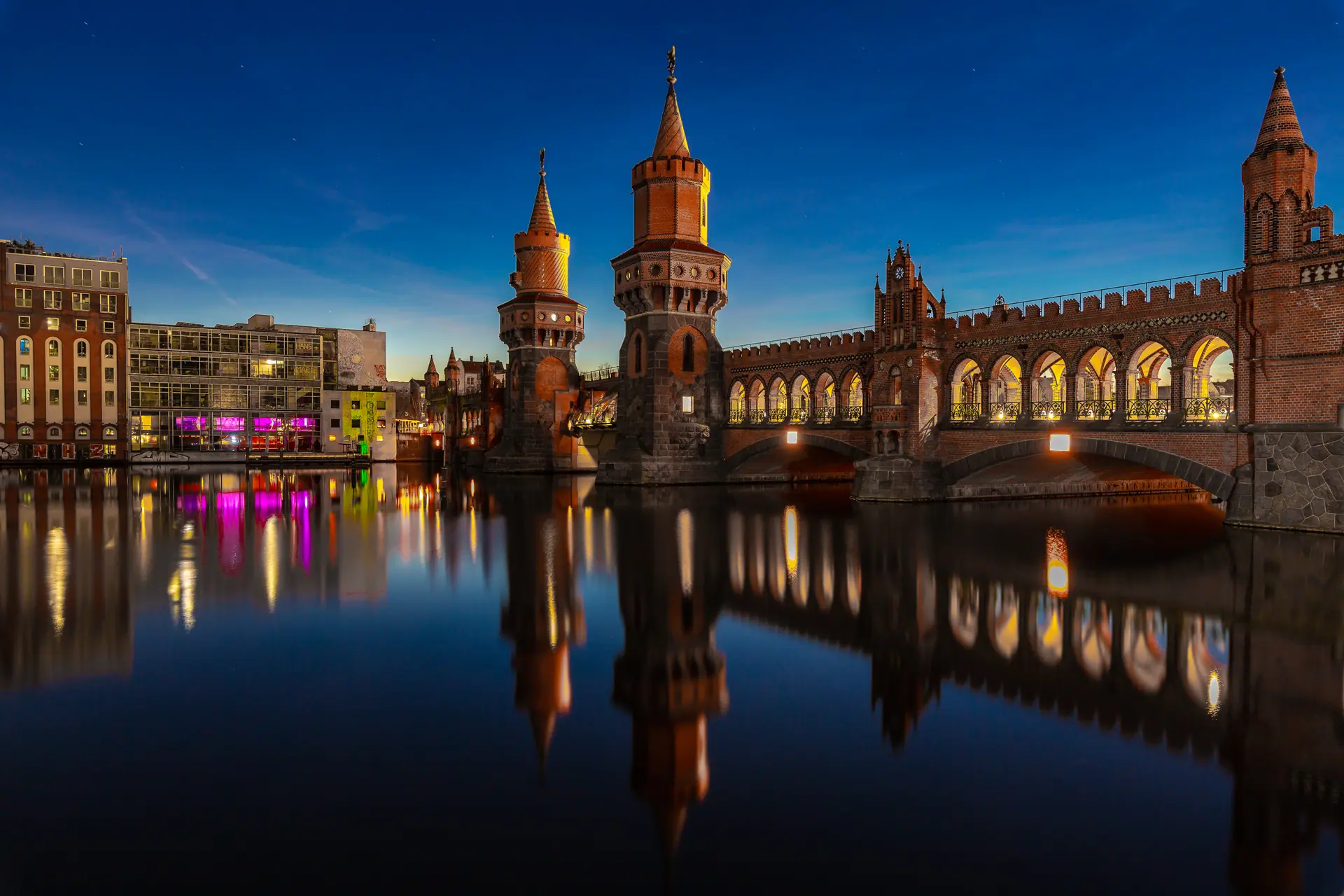 The Oberbaumbrücke at blue hour, reflected in the Spree