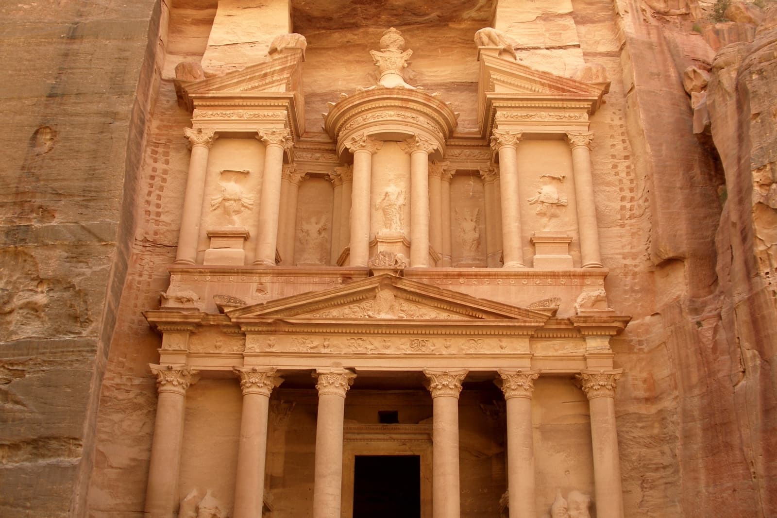 The carved rose-red façade of the Treasury, columns and pediment cut into the cliff