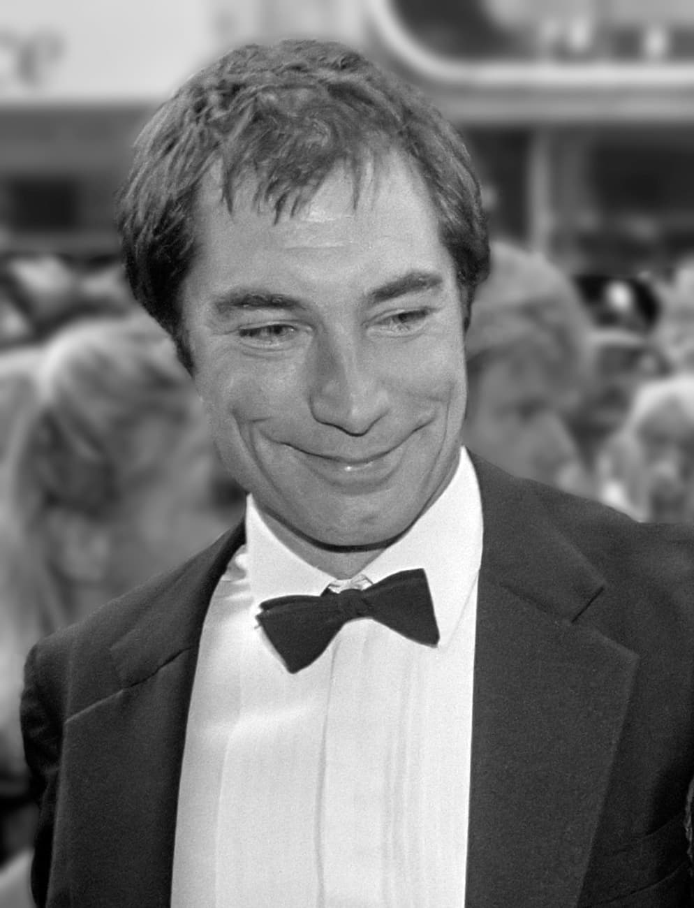 Timothy Dalton in a dinner jacket and bow tie, smiling
