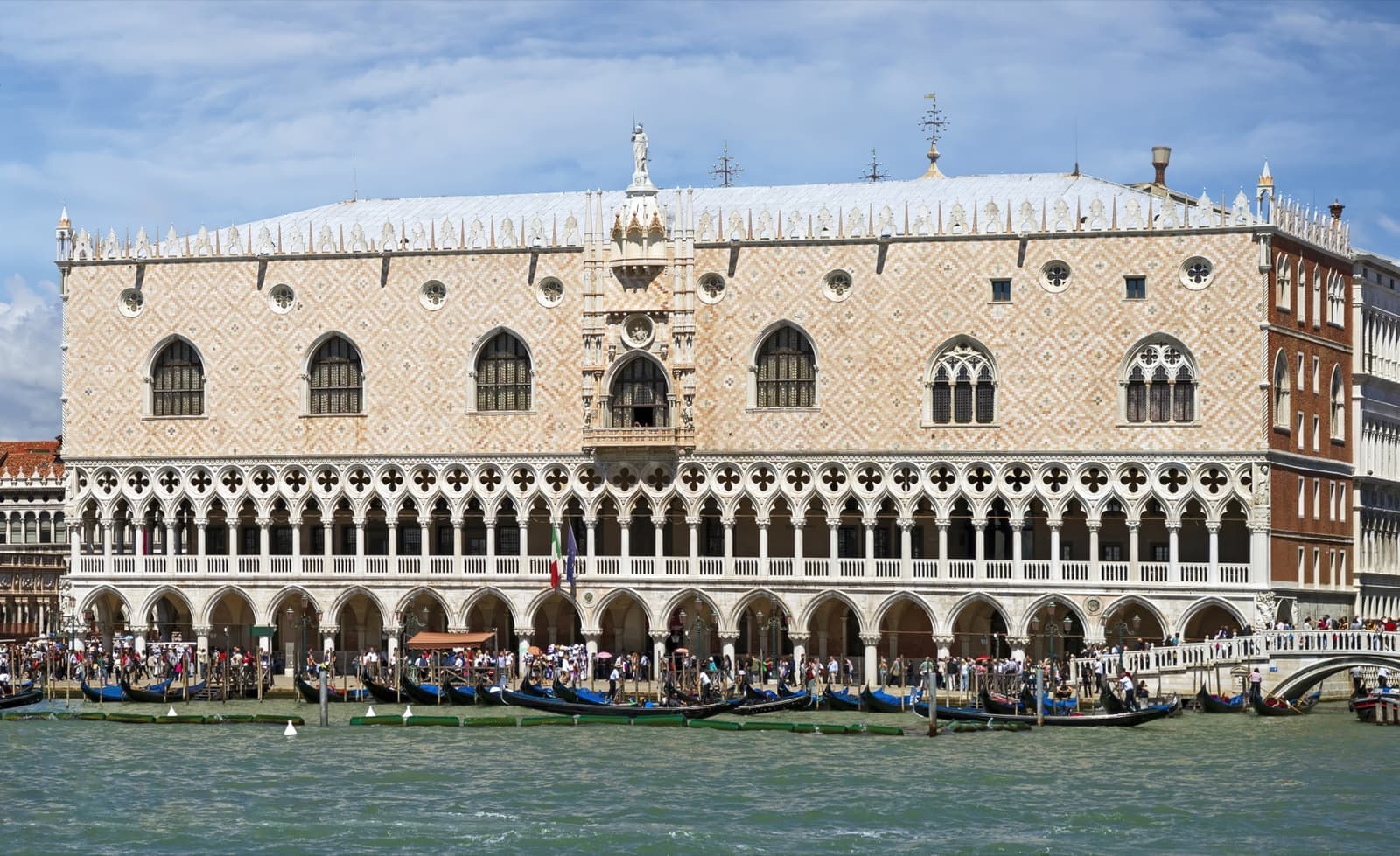 The pink and white Gothic arcades of the Doge’s Palace beside the lagoon