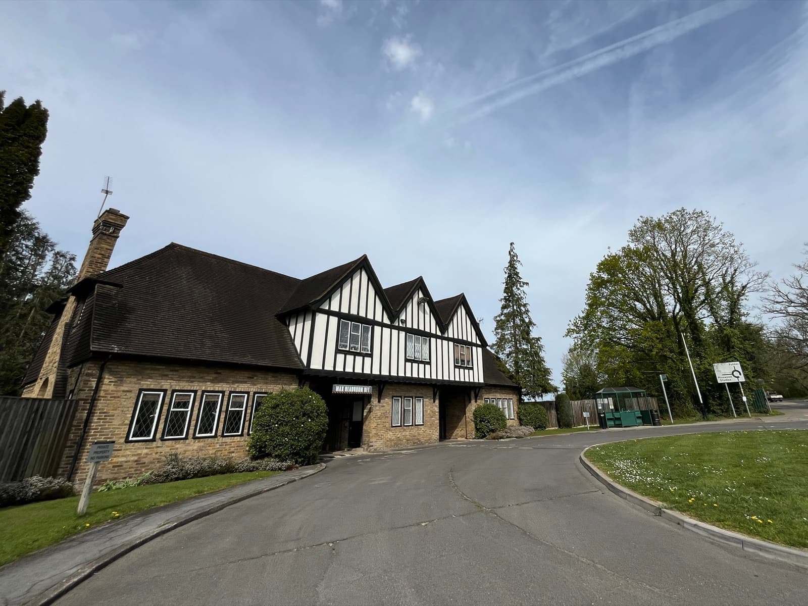 A studio gateway with a sign and gatehouse