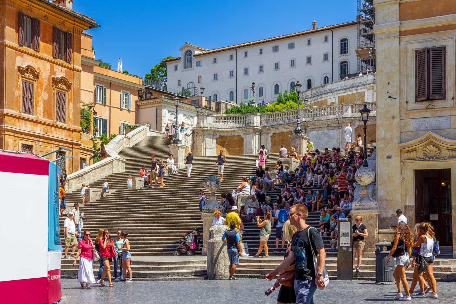 A wide flight of stone steps rising to a twin-towered church