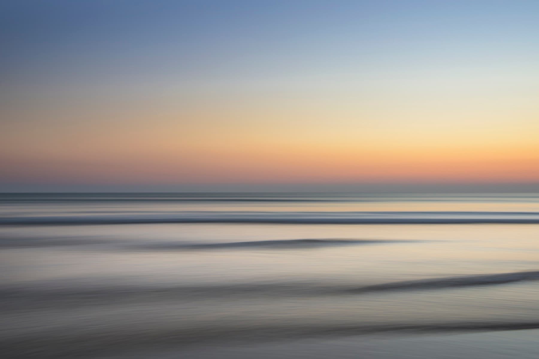 A long-exposure sea and sky at dusk