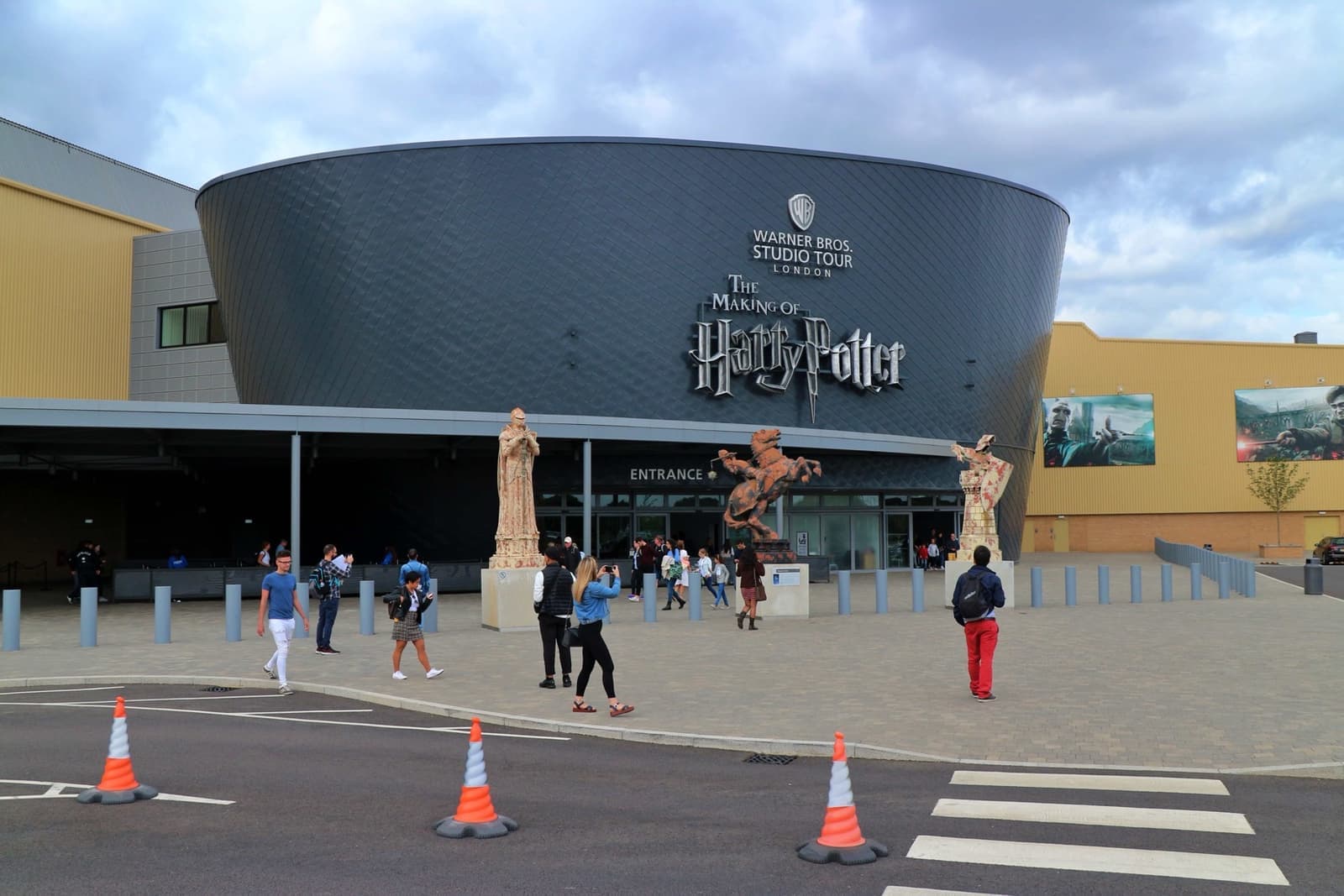 A dark drum-shaped building with Harry Potter lettering above the entrance