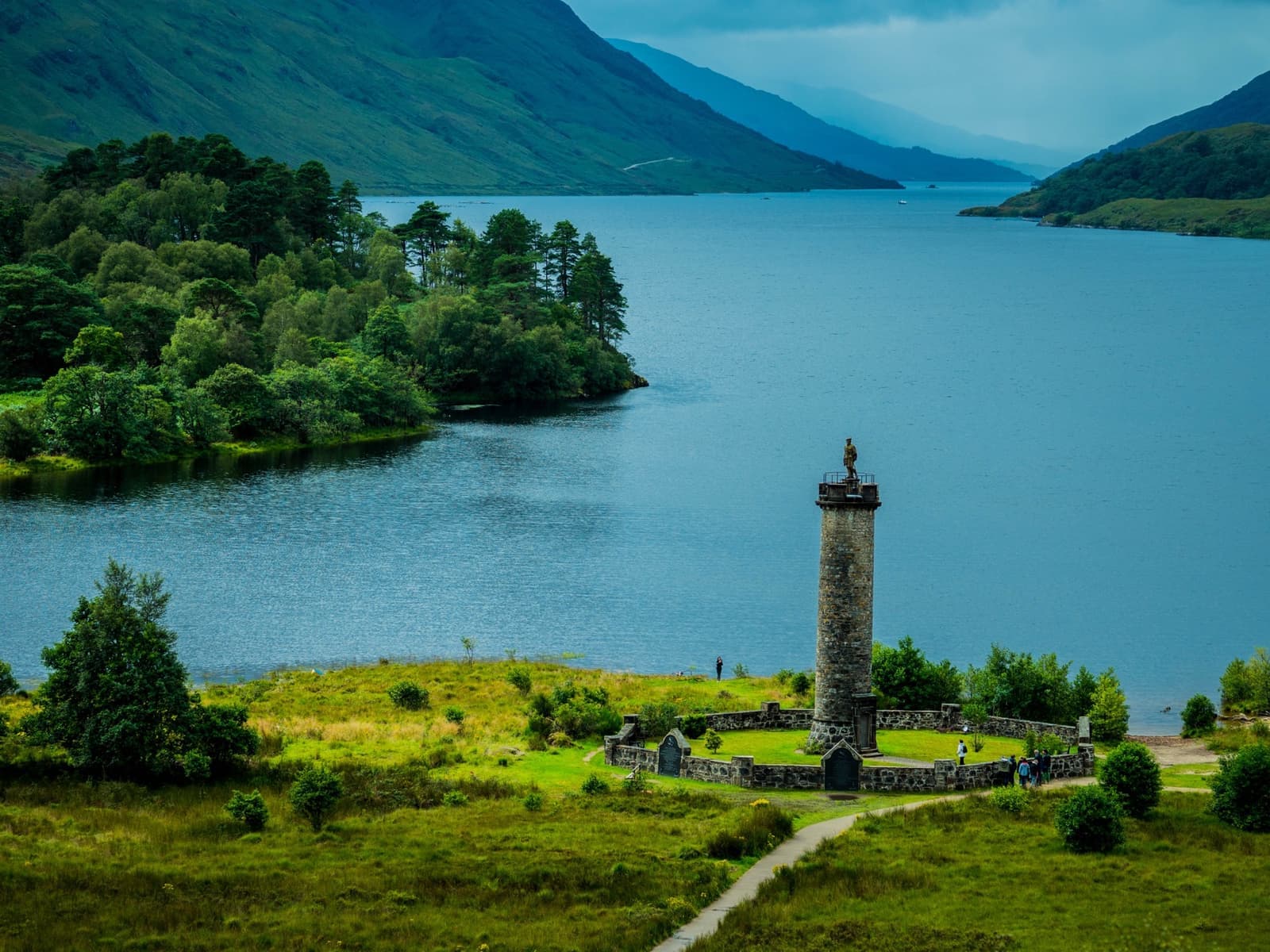A stone column at the head of a long loch between mountains