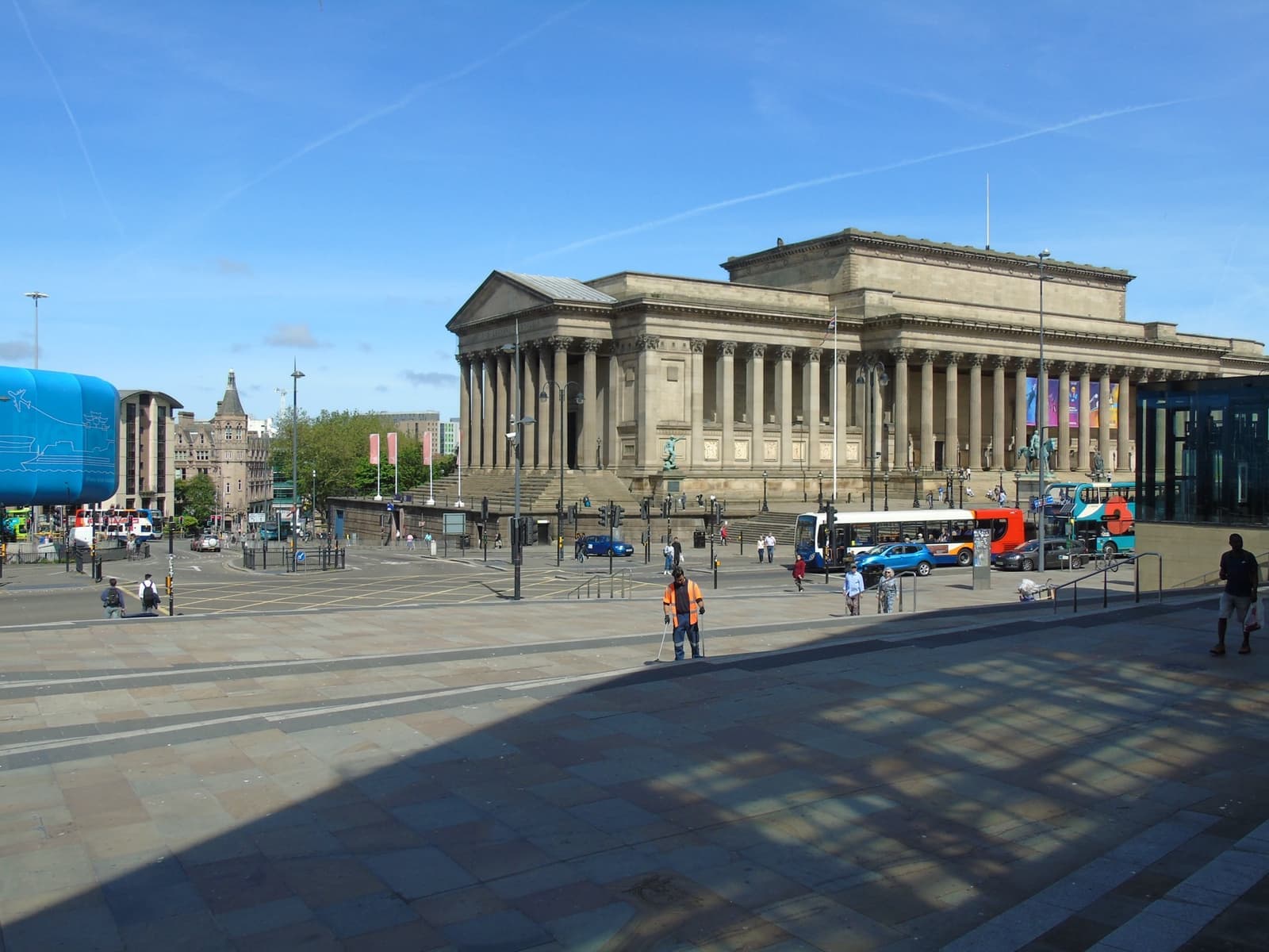 A long neoclassical colonnade above a plaza