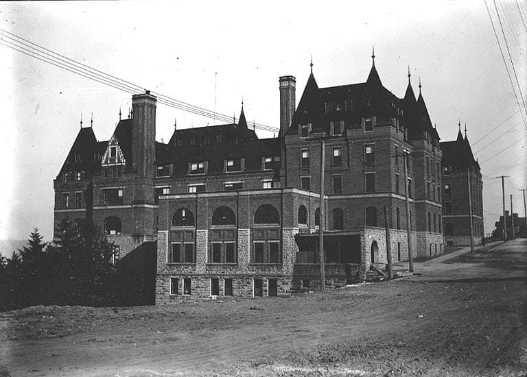 Black-and-white photograph of the château-style school around 1915