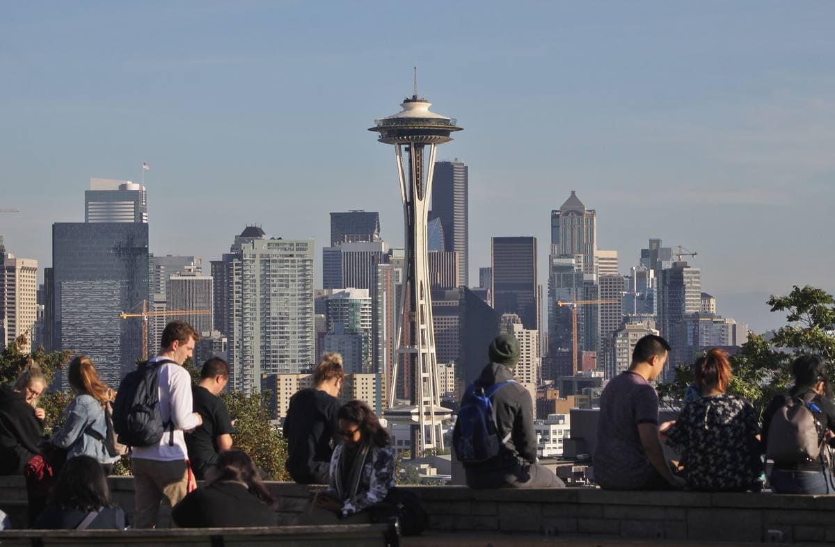 Seattle's skyline and the Space Needle seen over trees from Kerry Park
