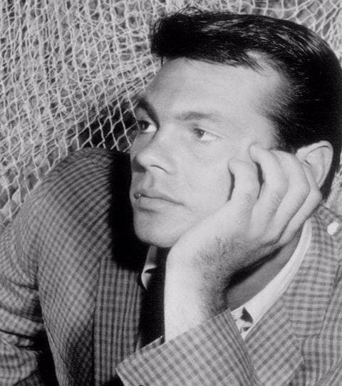 Gary Lockwood, a young man with short dark hair, smiling