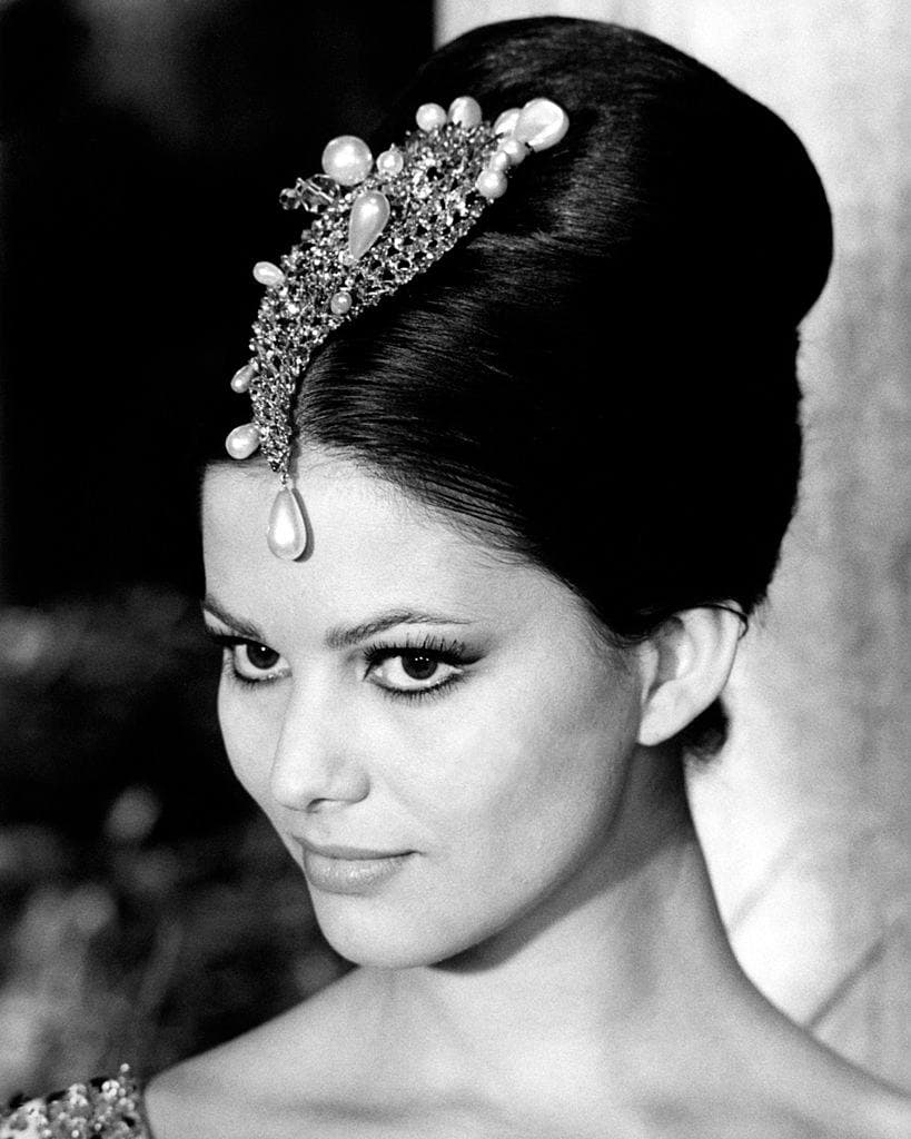 Claudia Cardinale in close-up, her hair up with a jewelled ornament