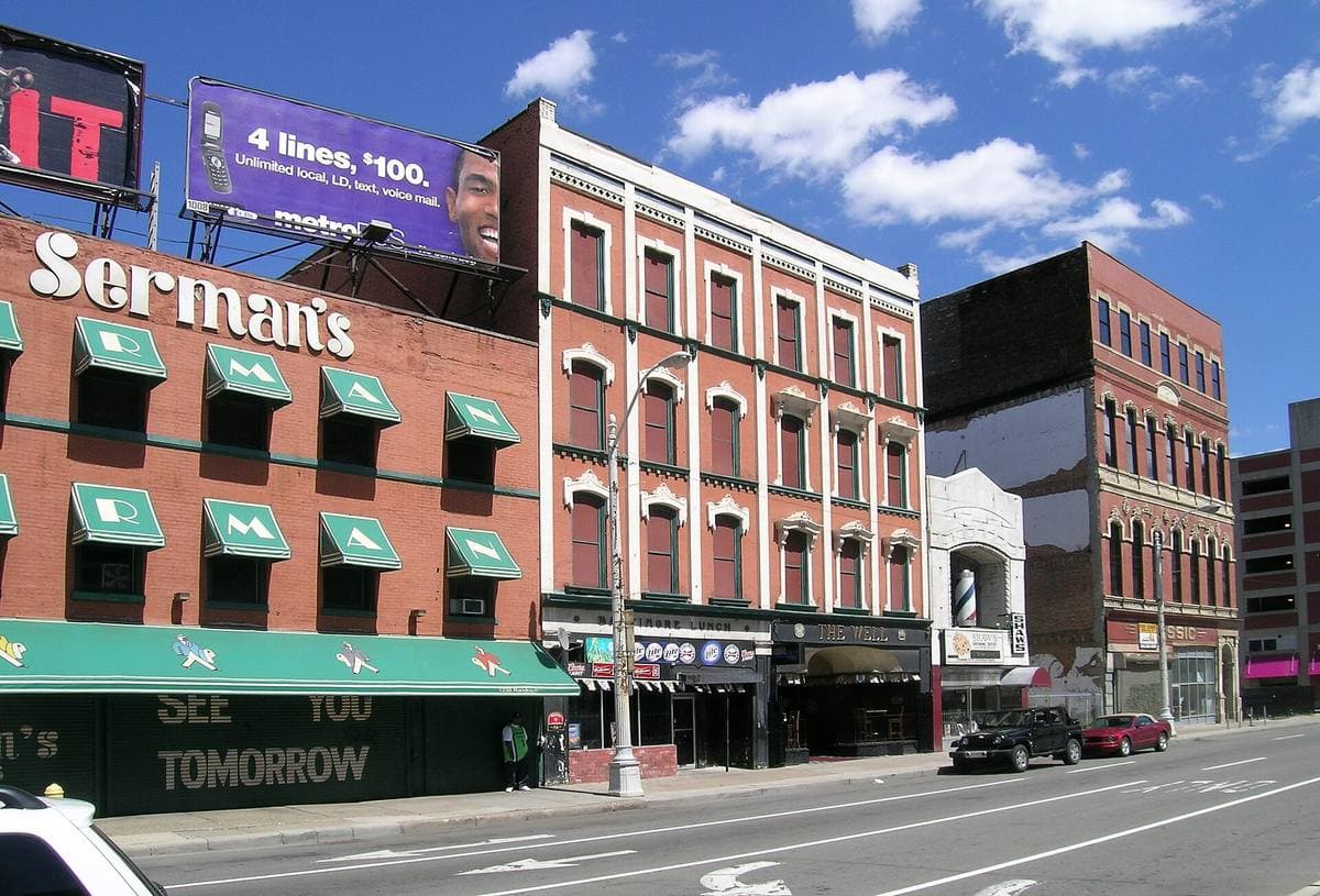 A row of older brick shopfronts along Randolph Street in downtown Detroit