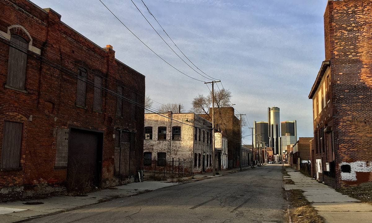 Old brick warehouses along a quiet cobbled street in Detroit's Rivertown district
