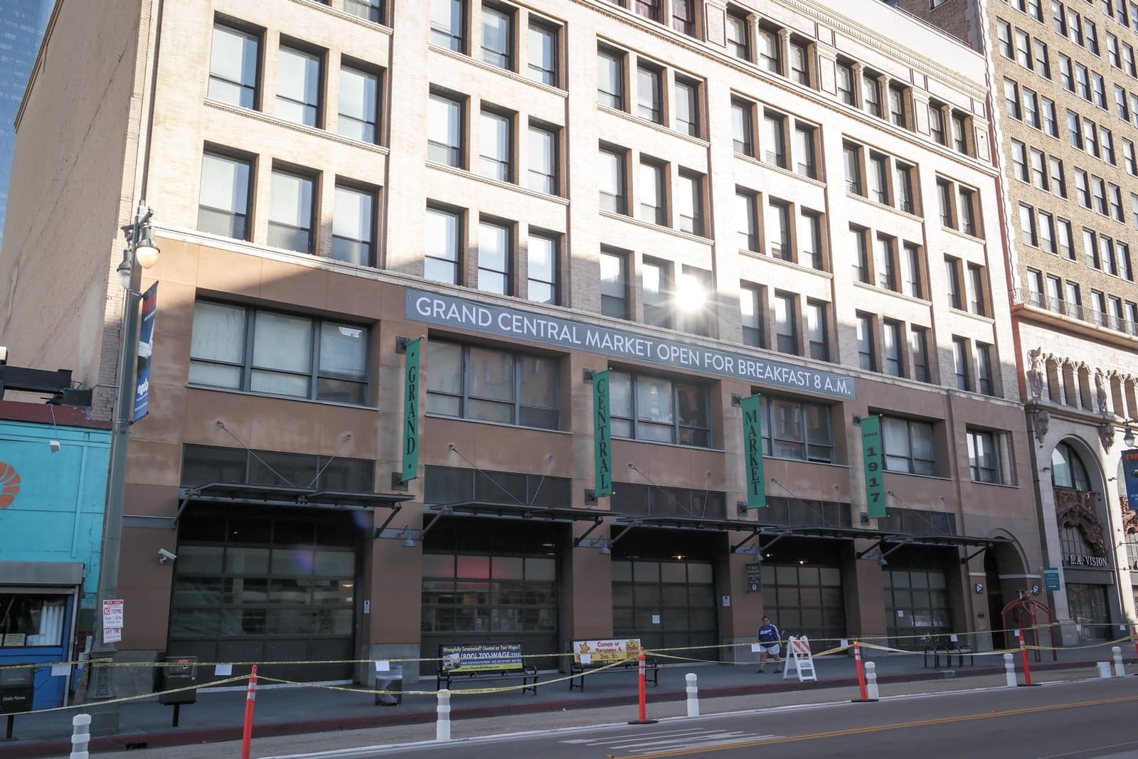 A pale six-storey commercial block with a Grand Central Market sign at street level