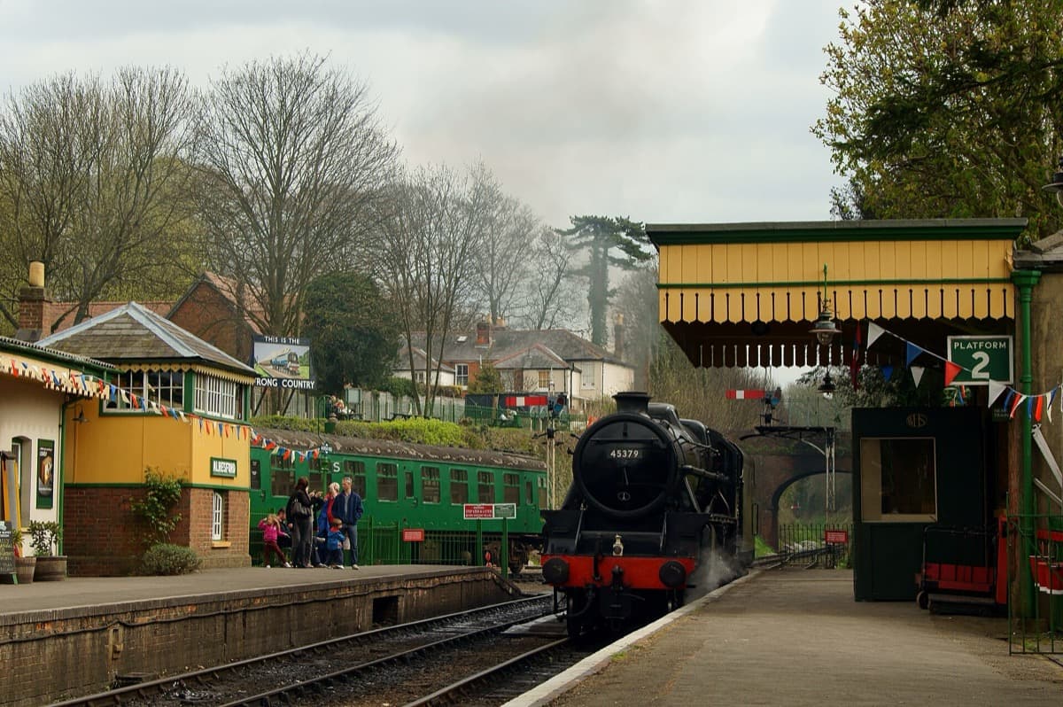 A small railway station with a platform and a canopy