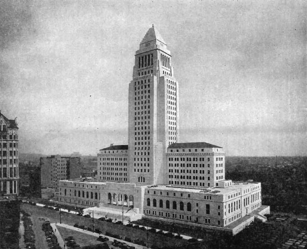 A black-and-white view of the tall tower and its wings