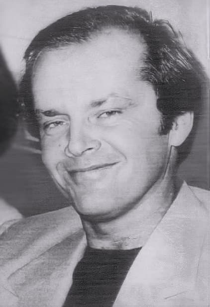 Jack Nicholson smiling, in a light jacket