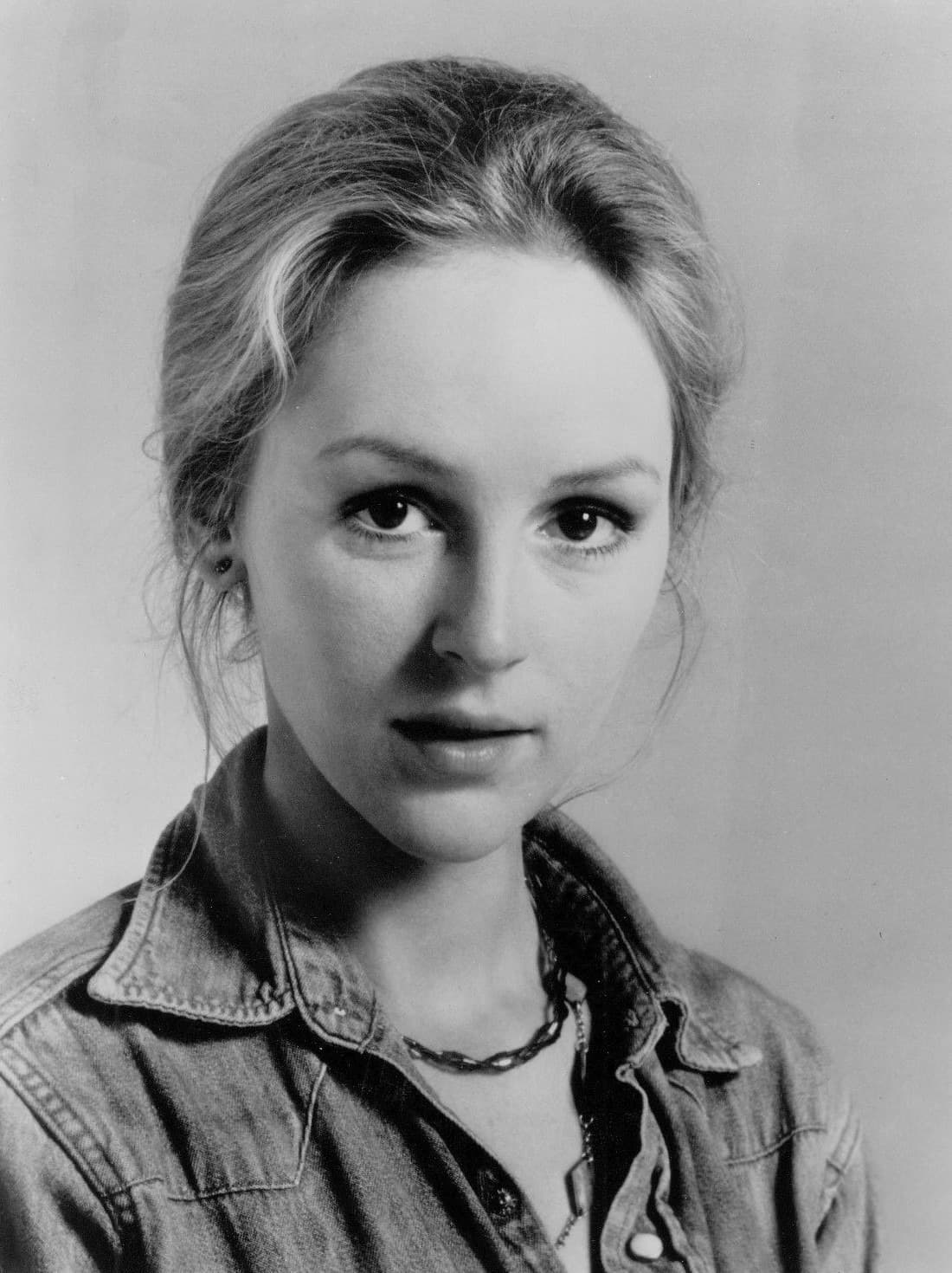 Black-and-white portrait of Bonnie Bedelia in a denim shirt
