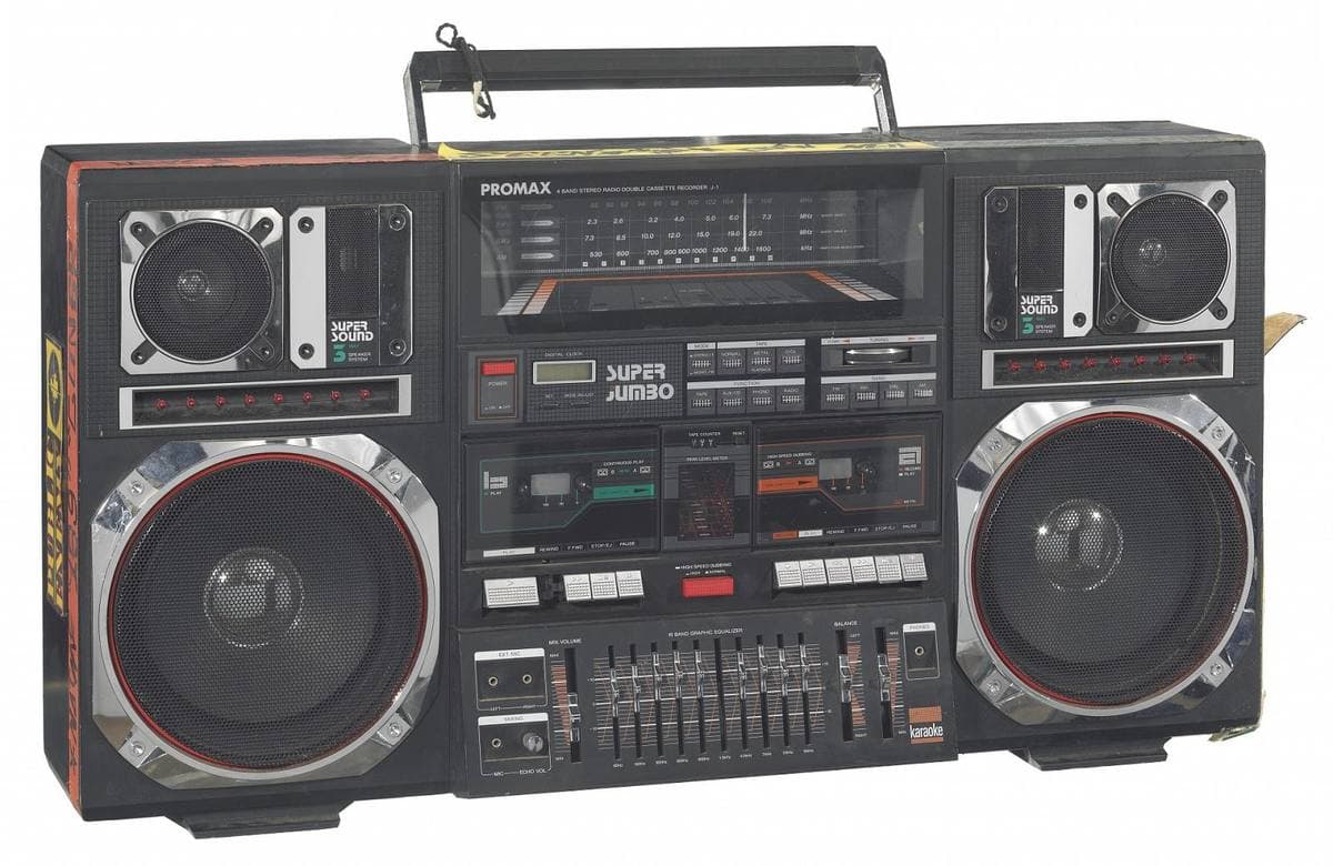 A large black boombox with two big chrome-ringed speakers, twin cassette decks and a graphic equaliser