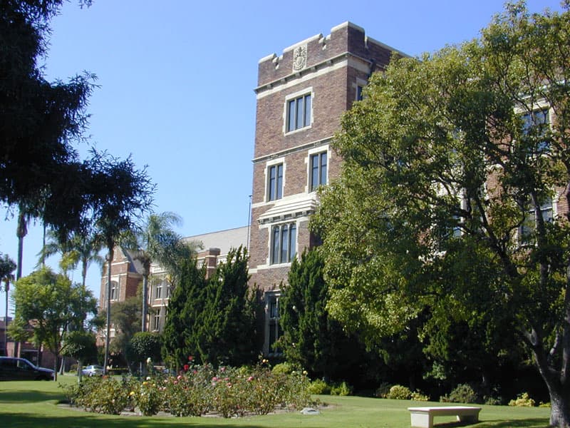 A Gothic Revival school building with a tower