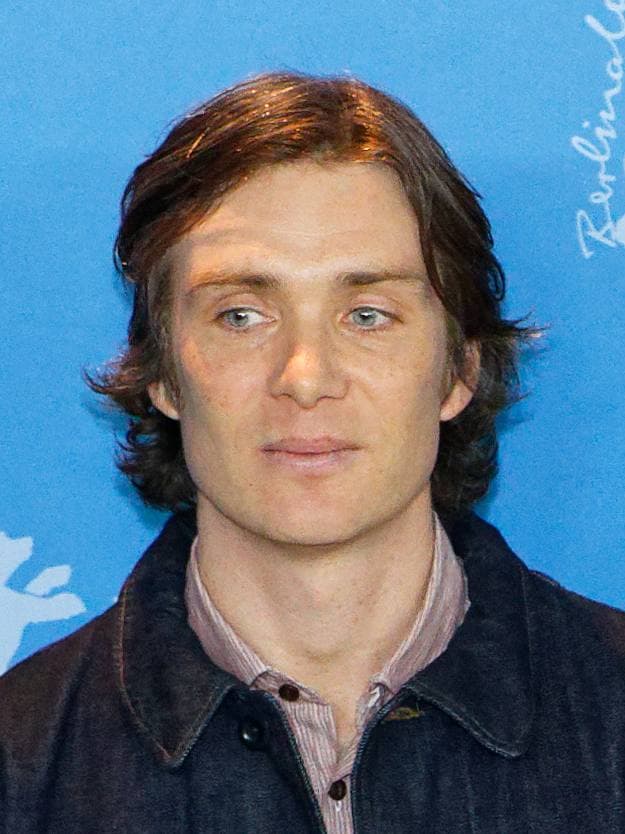 Cillian Murphy with short hair and a dark jacket