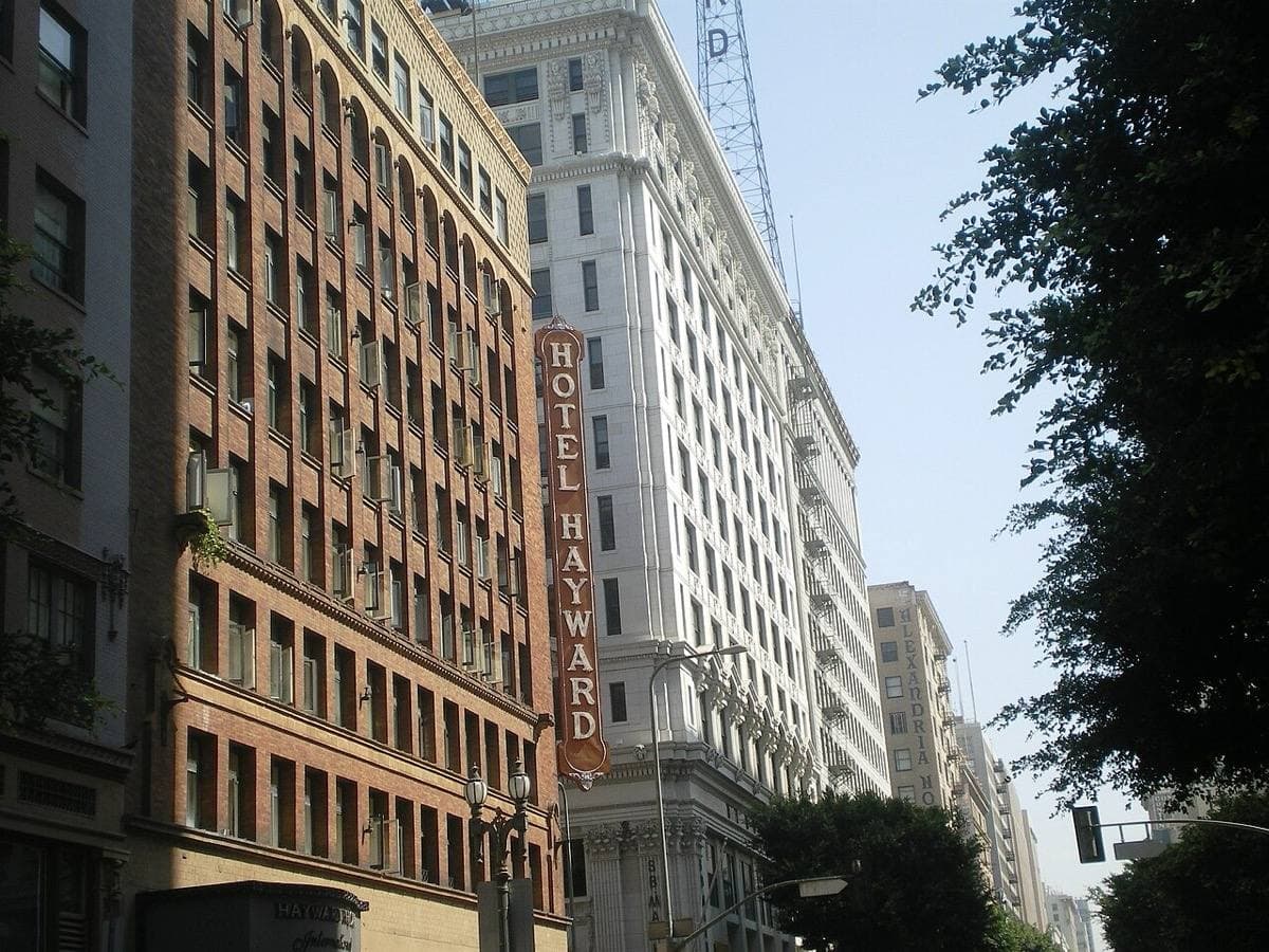 A downtown street of tall early twentieth-century office buildings