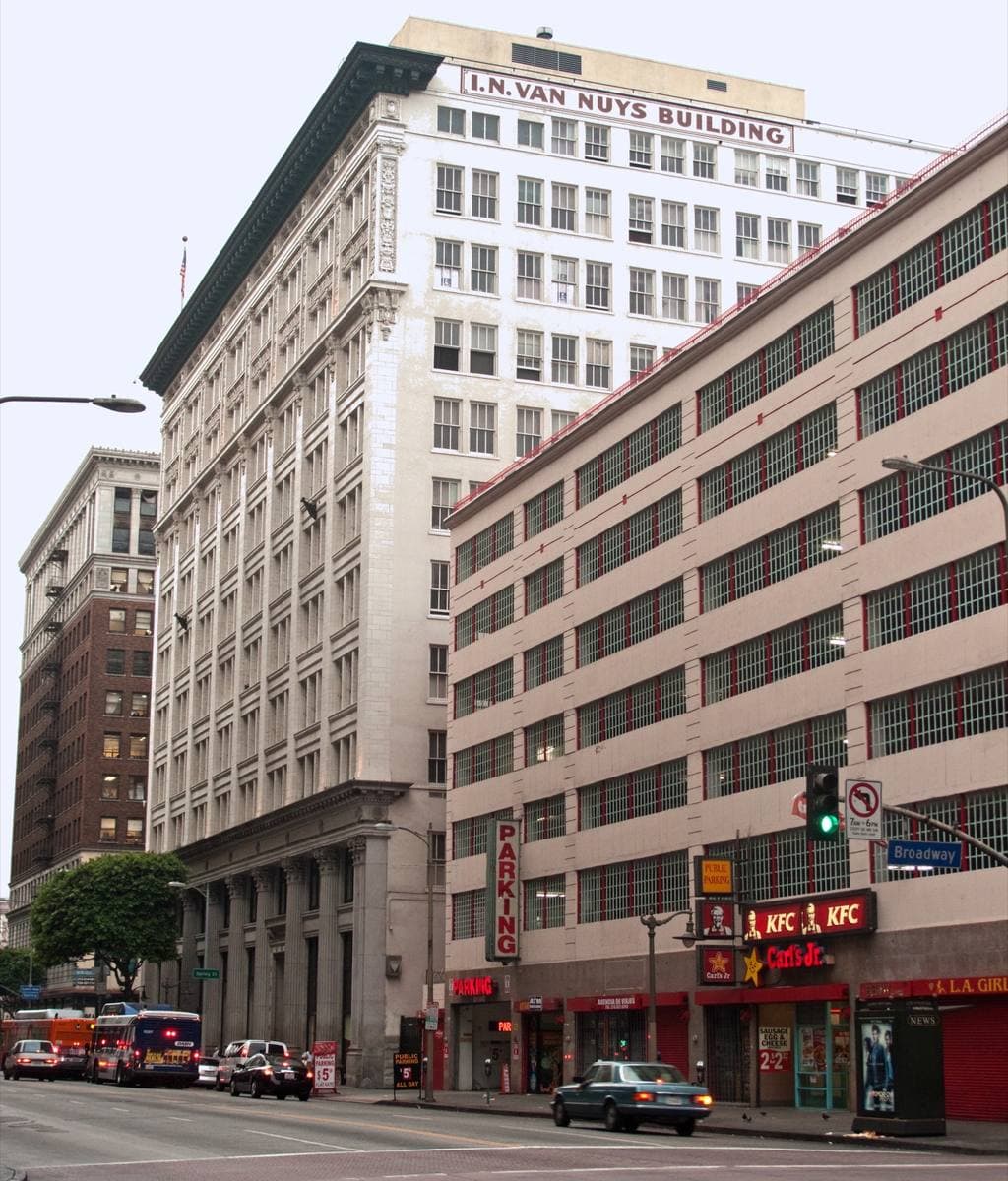 Tall pale office buildings at a downtown Los Angeles street corner