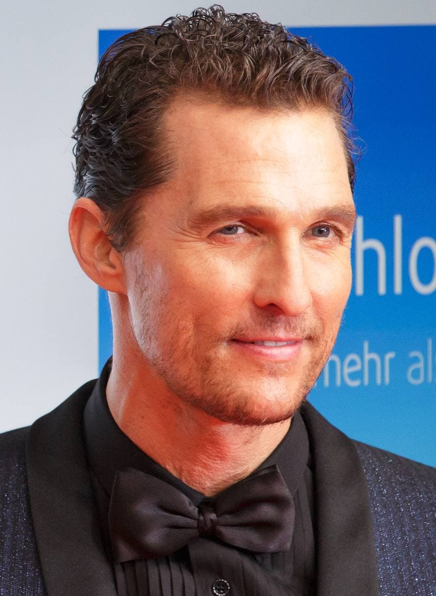 Matthew McConaughey in a dinner jacket and bow tie, smiling