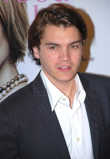 Emile Hirsch, young, with short dark hair, in a dark suit and open white shirt