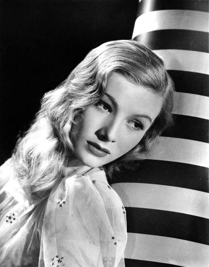 Veronica Lake in black and white, her fair hair falling over one eye