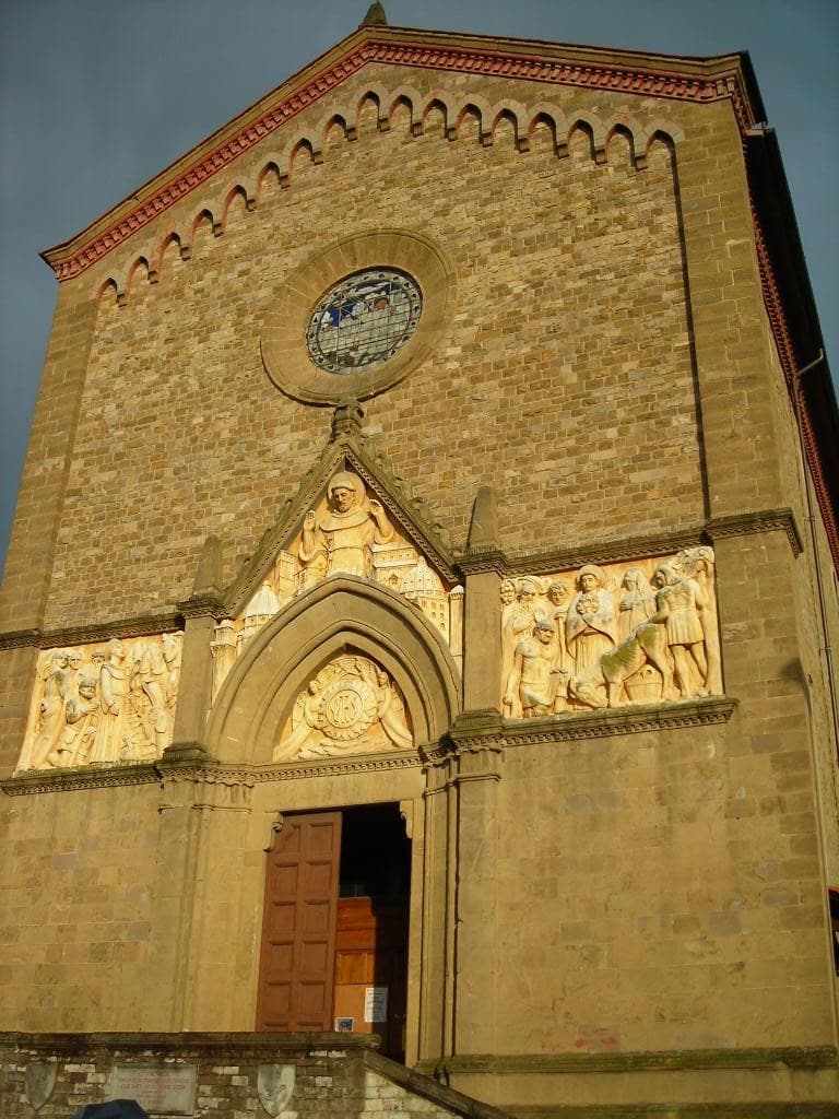 Brick and stone church front on a quiet square