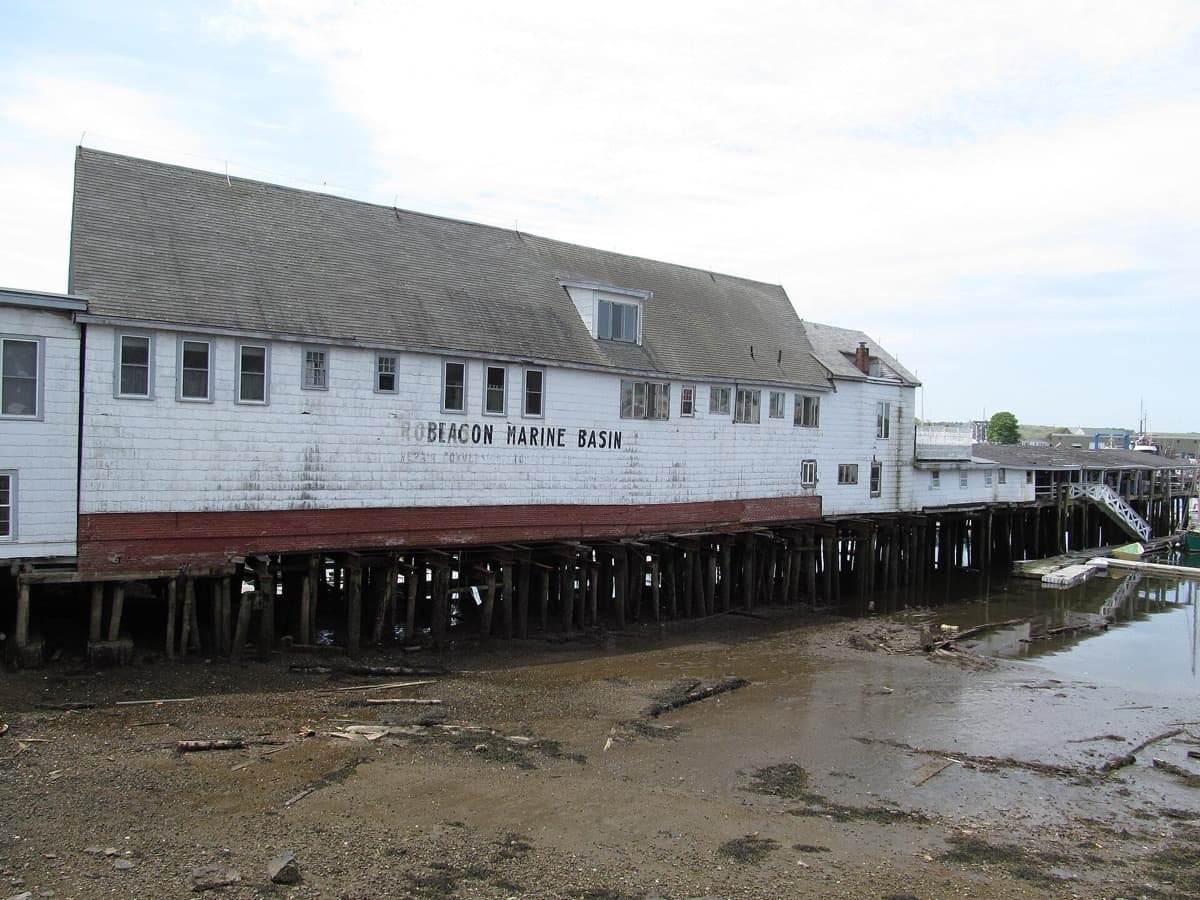 A low waterfront building at a marina in Gloucester