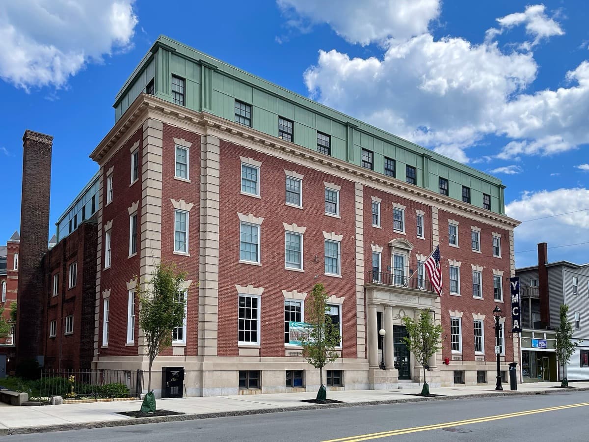 A tall brick building on a corner street in Beverly