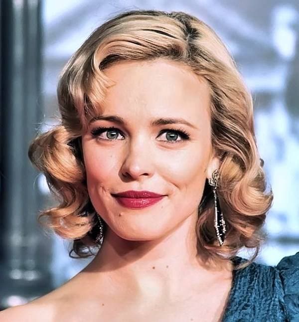 Rachel McAdams with waved blonde hair and red lipstick