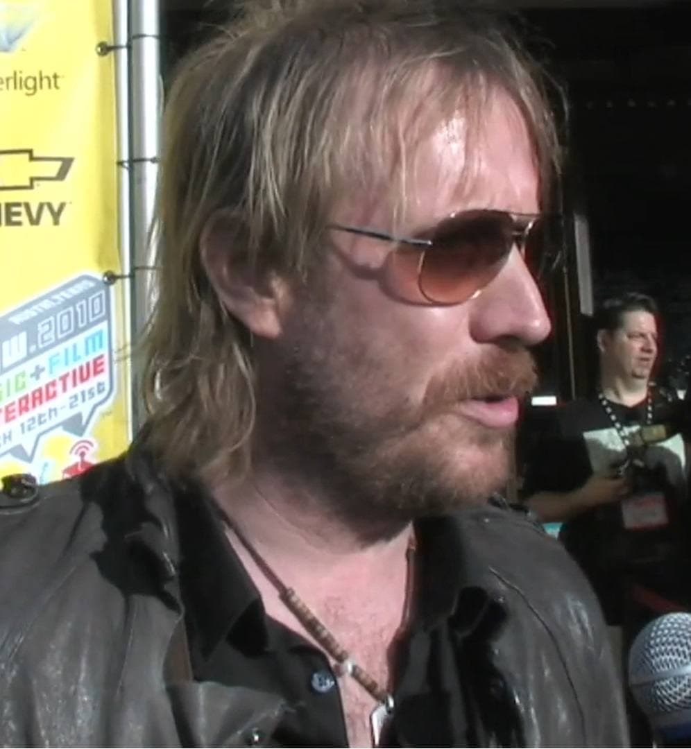 Rhys Ifans being interviewed on a red carpet