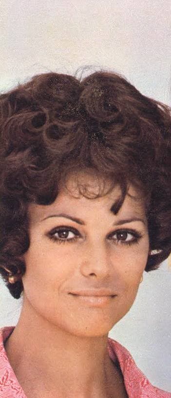 Claudia Cardinale smiling, dark hair, pink collar, in colour