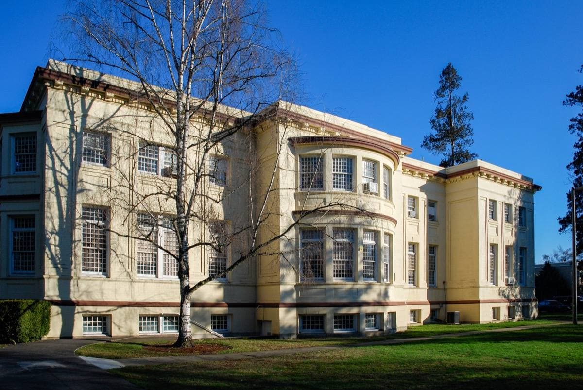 A domed Beaux-Arts building with long wings