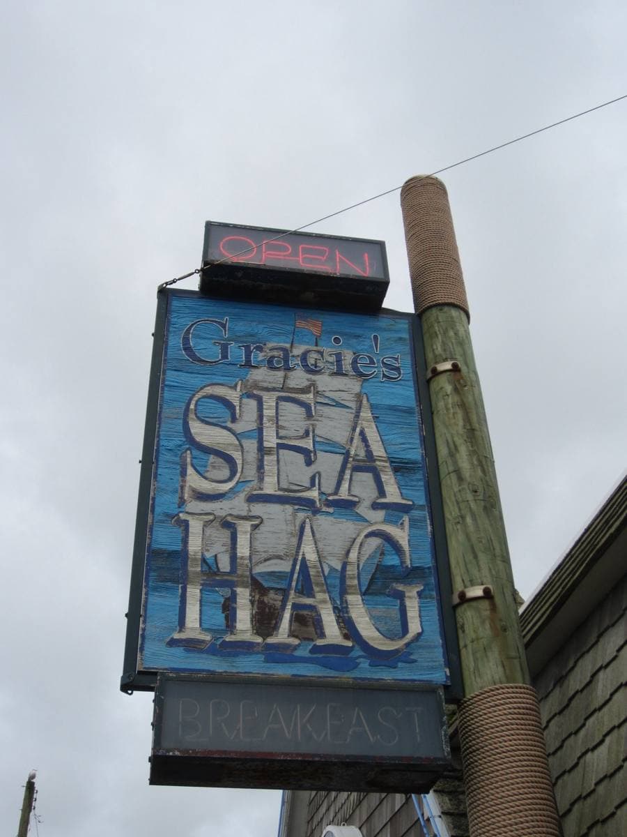 The front of Gracie’s Sea Hag restaurant with its sign