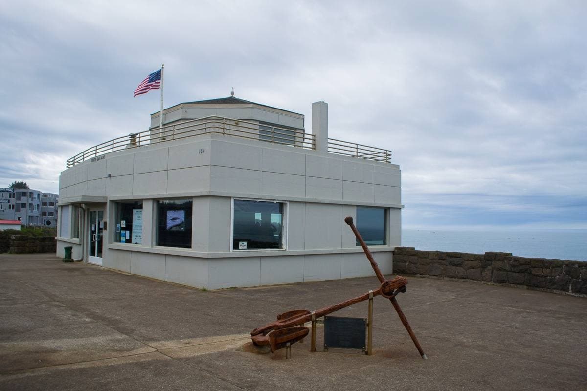 A small building on the seawall above the ocean