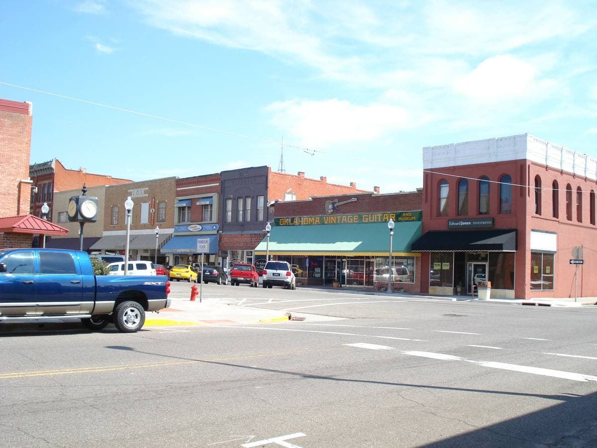 A wide main street of low brick shops in El Reno