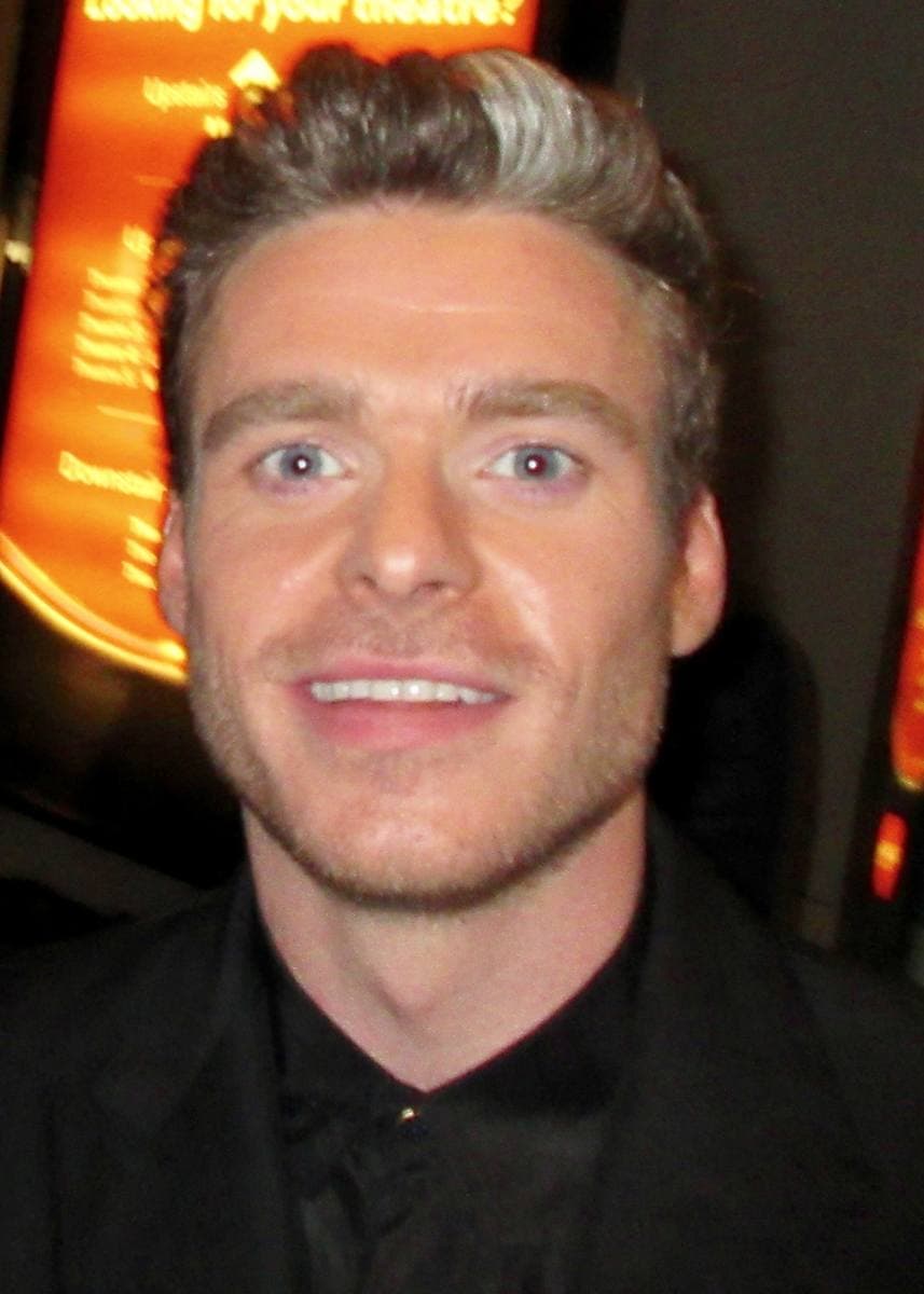Richard Madden smiling at night