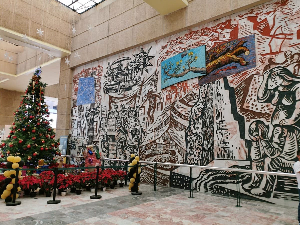 A large painted mural in a hospital lobby
