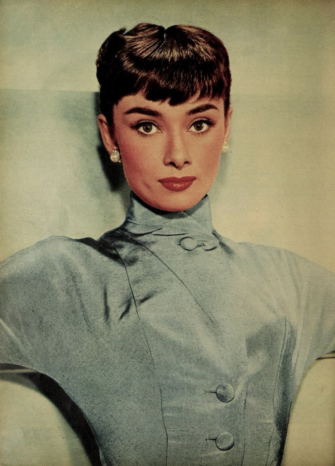 Studio portrait of Audrey Hepburn with short dark hair