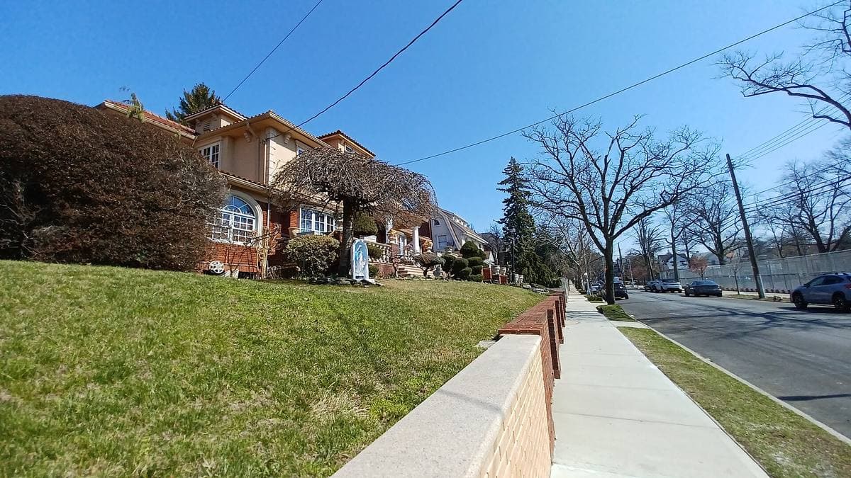 A quiet residential street of detached and semi-detached houses in Bay Ridge