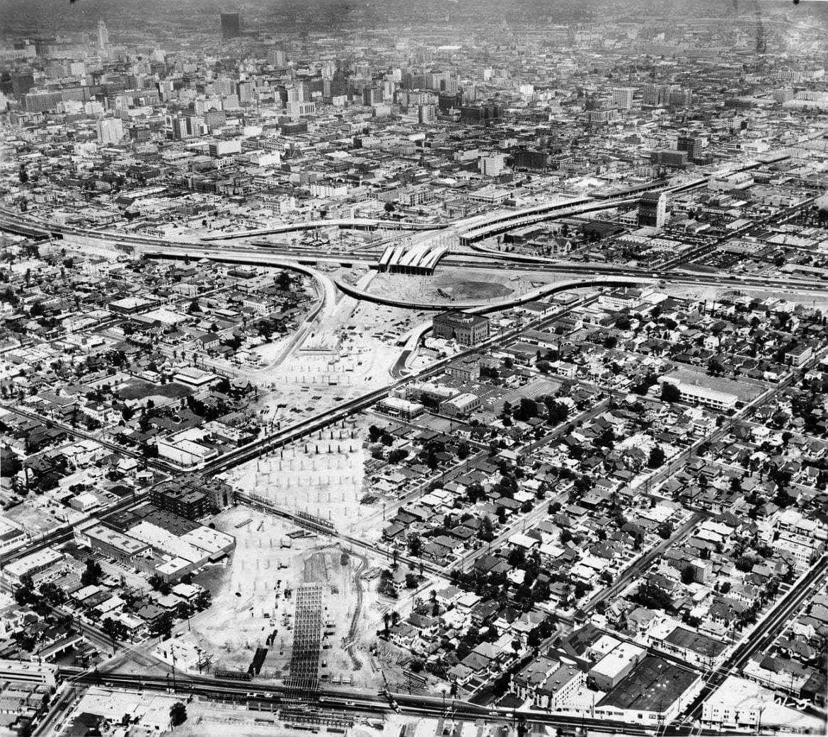 An aerial photograph of a freeway interchange under construction, ramps still unfinished