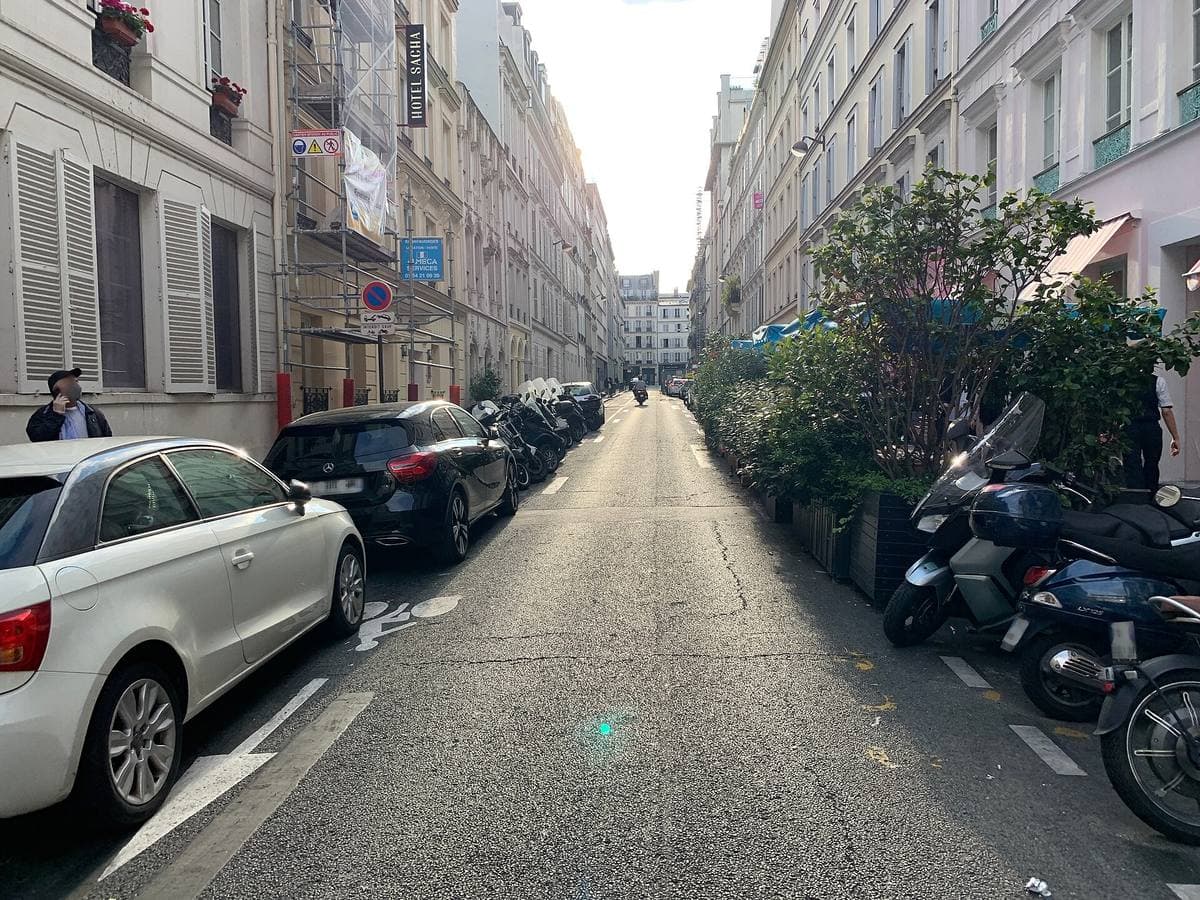 A quiet street of tall Paris apartment buildings