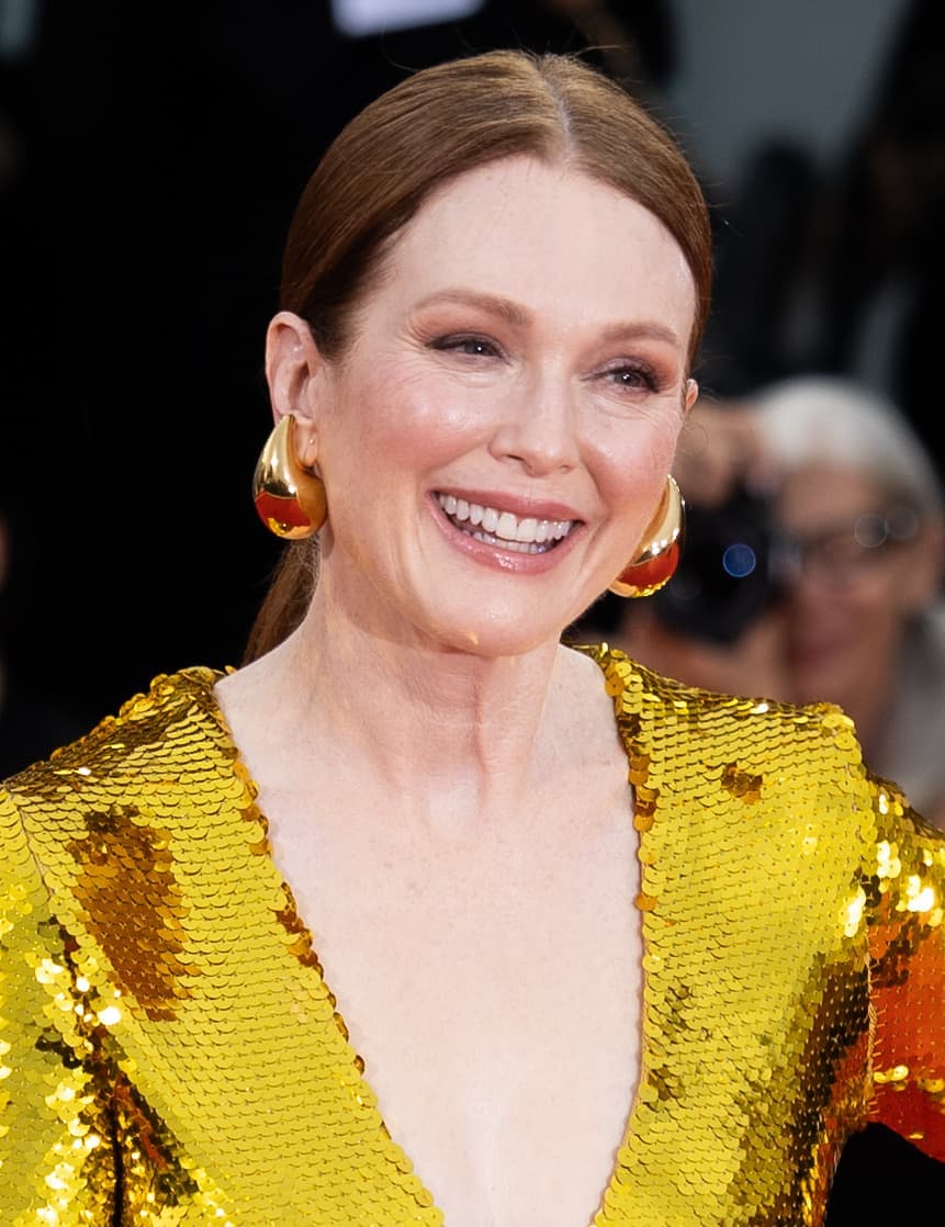Julianne Moore laughing, in a gold sequinned dress