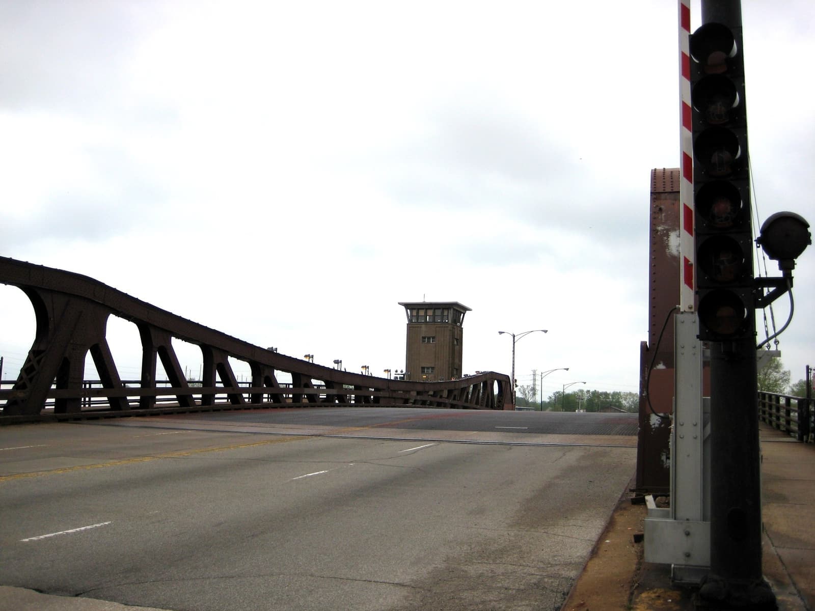 A steel bascule bridge on East 95th Street with a traffic signal