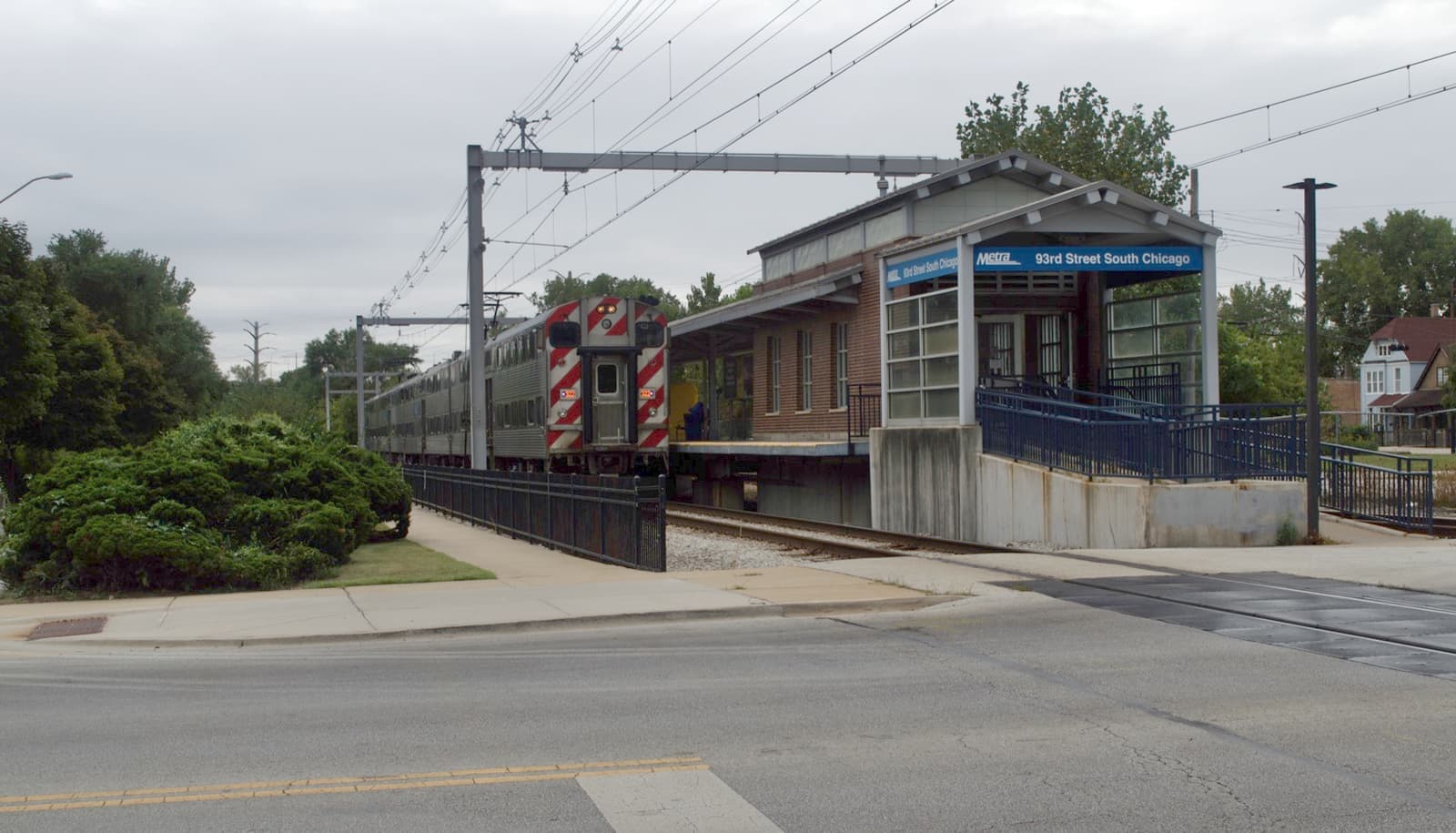 A small station building on an electrified rail line in South Chicago