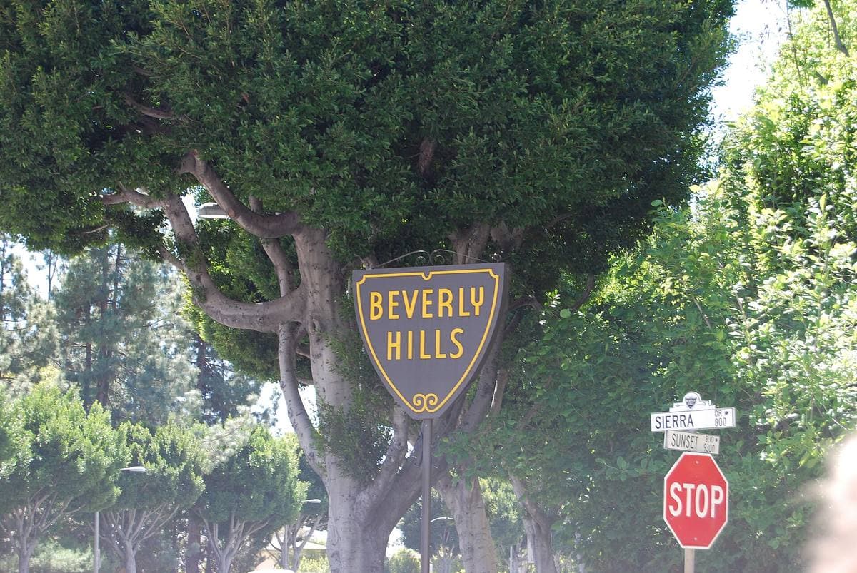A Beverly Hills sign among trees