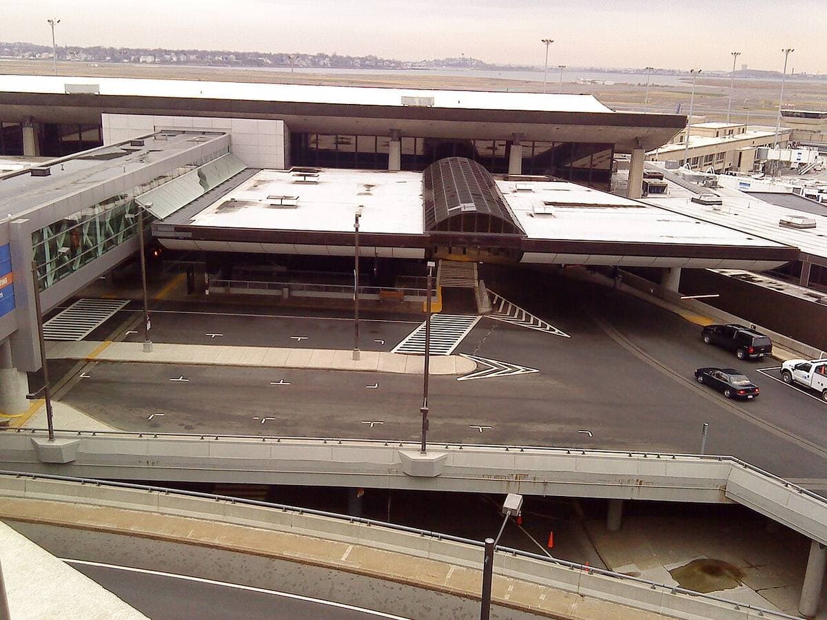 Airport terminal roofs and roadways seen from above